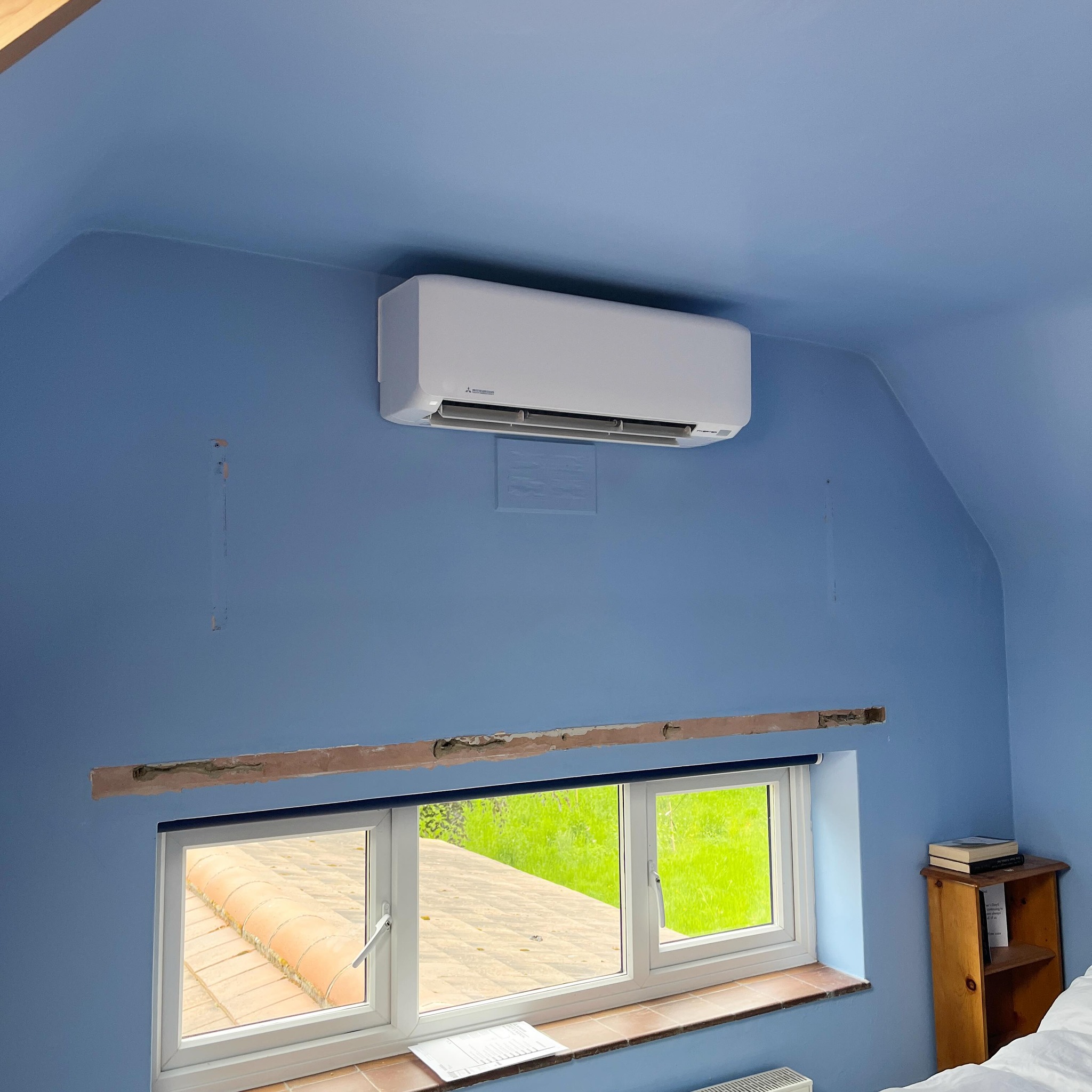 Mitsubishi heat pump system exterior installation in Wigan